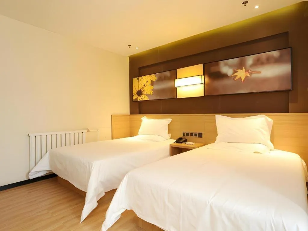 Bed in IU Hotel Tianjin Xiqing Zhong Bei Zhen Branch
