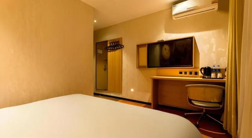 Bed in IU Hotel Tianjin Xiqing Zhong Bei Zhen Branch