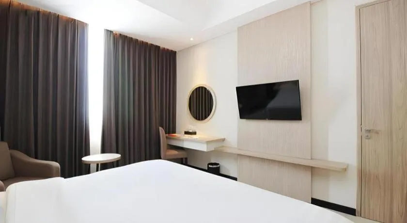 Bed in Hotel Dafam Pacific Caesar