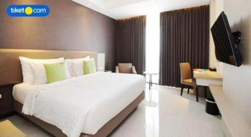 Bed in Hotel Dafam Pacific Caesar