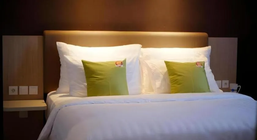 Bed in Hotel Dafam Pacific Caesar