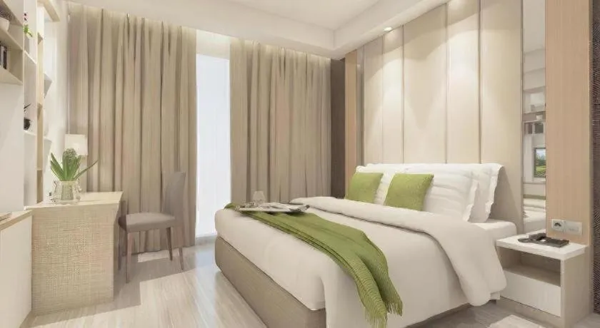 Bed in Hotel Dafam Pacific Caesar