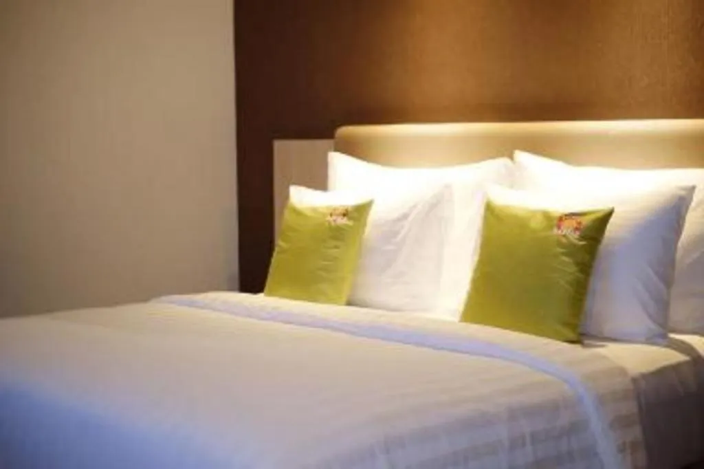 Bed in Hotel Dafam Pacific Caesar