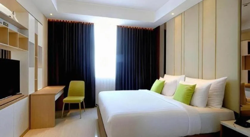 Bed in Hotel Dafam Pacific Caesar