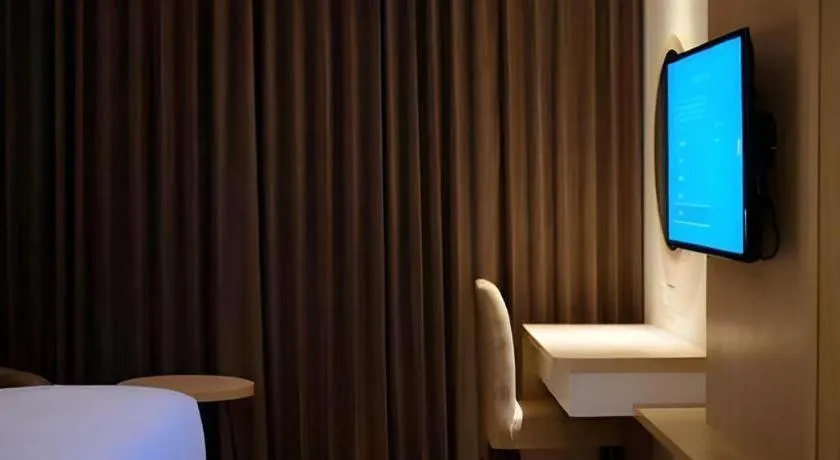 Bed in Hotel Dafam Pacific Caesar