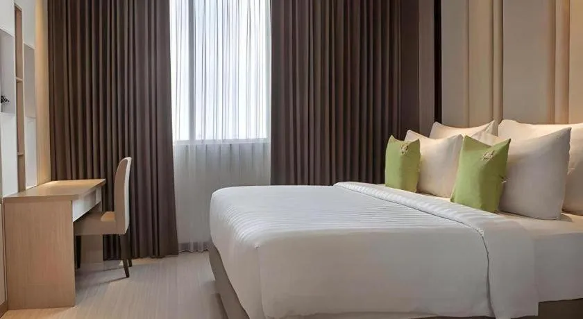 Bed in Hotel Dafam Pacific Caesar