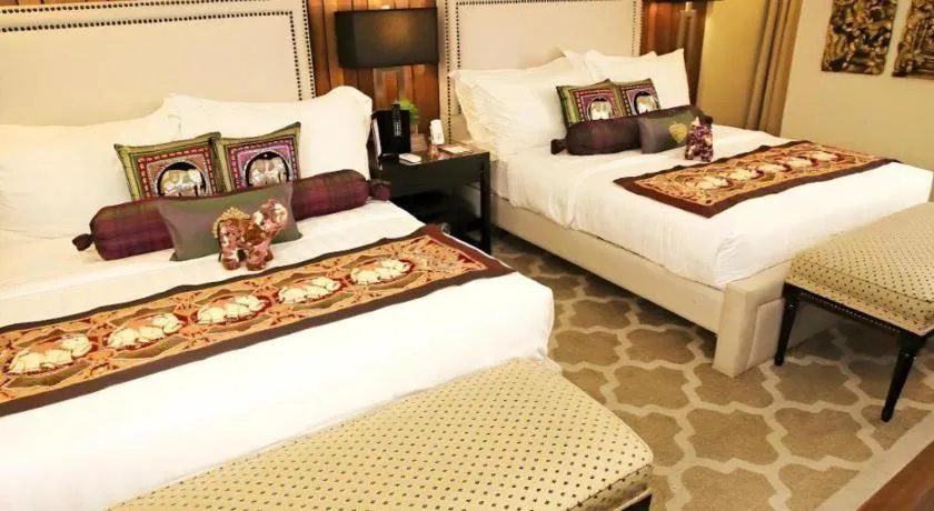 Bed in The Oriental Luxury Suites Tagaytay