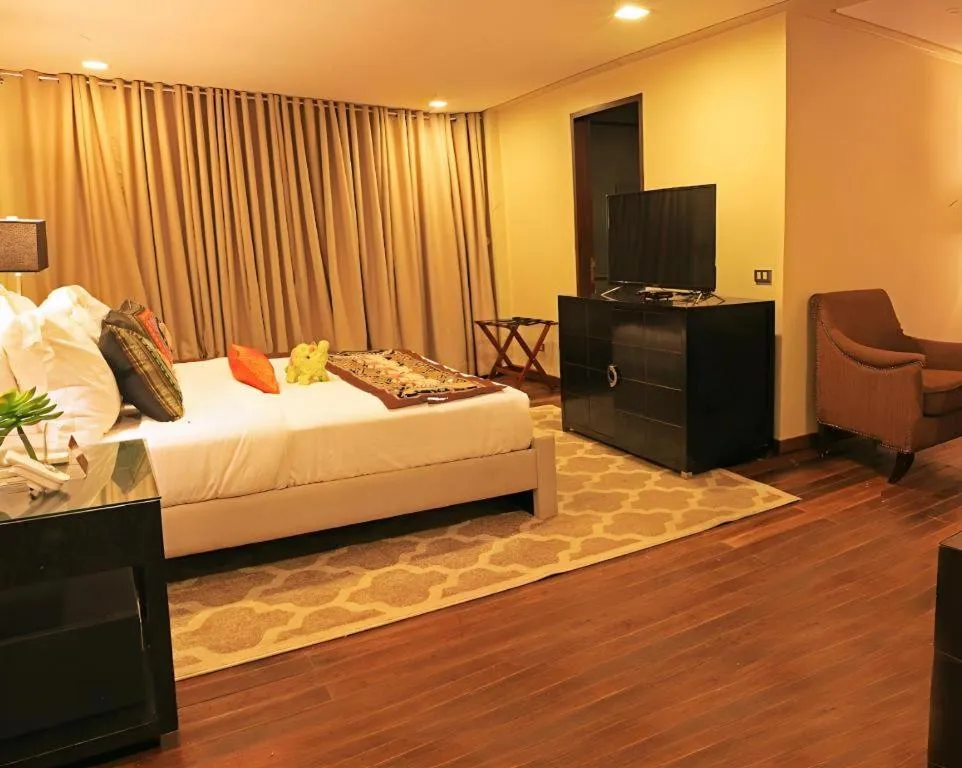 Bed in The Oriental Luxury Suites Tagaytay