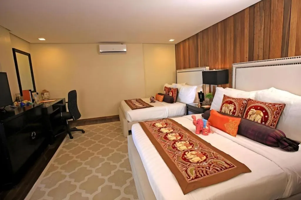 Bed in The Oriental Luxury Suites Tagaytay