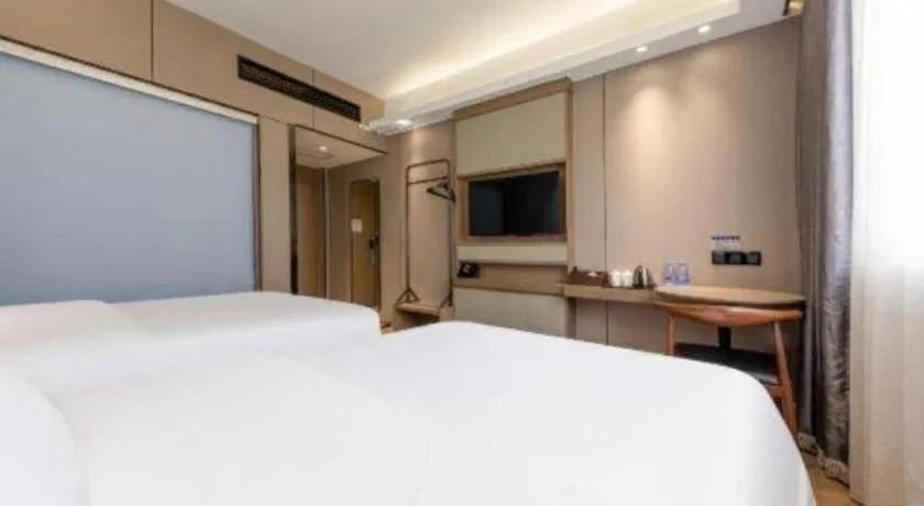 Bed in Mao Hua hotel