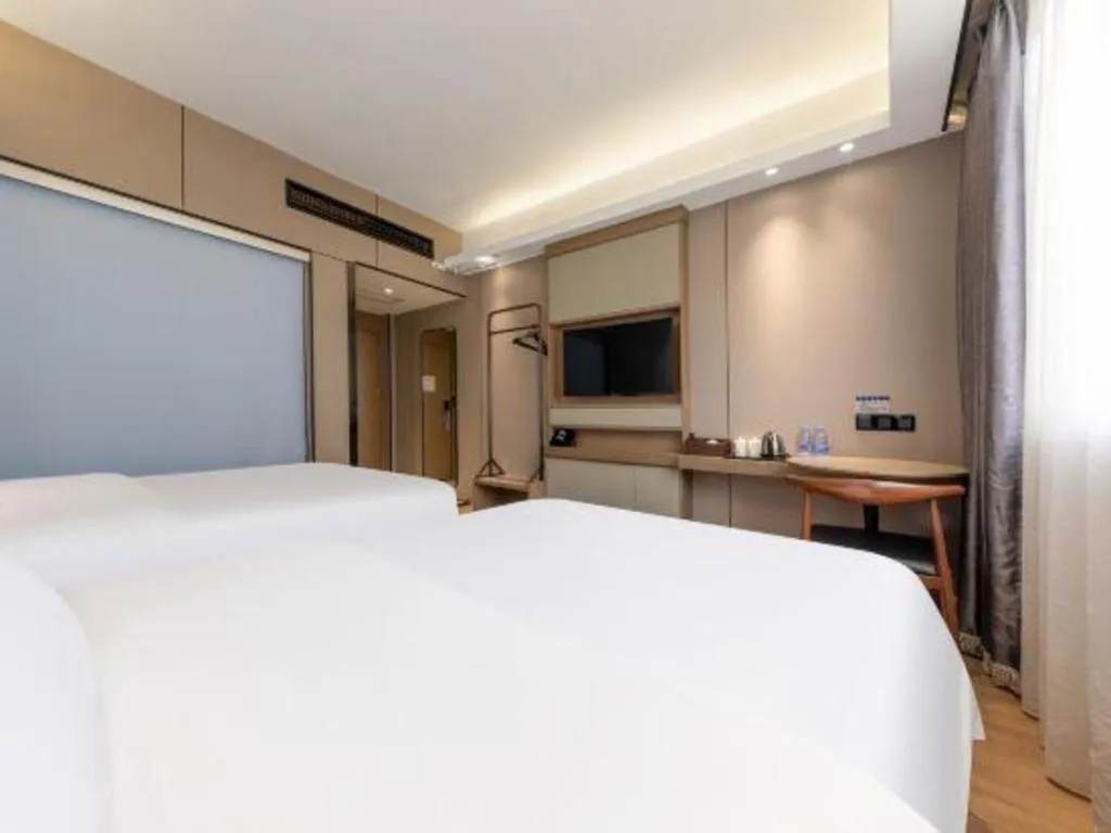 Bed in Mao Hua hotel