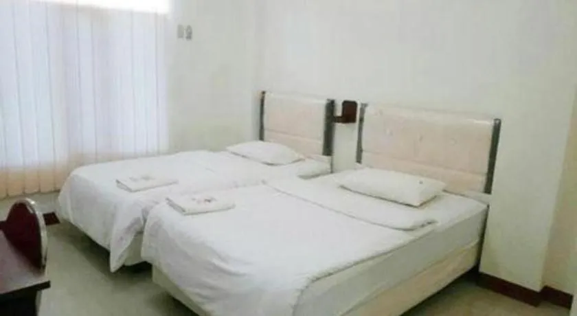 Bed in Avicenna Hotel