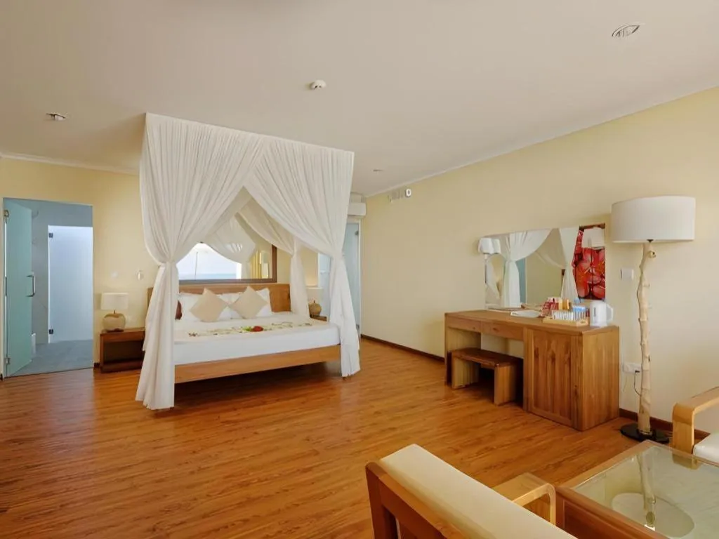 Bed in Angaga Island Resort and Spa