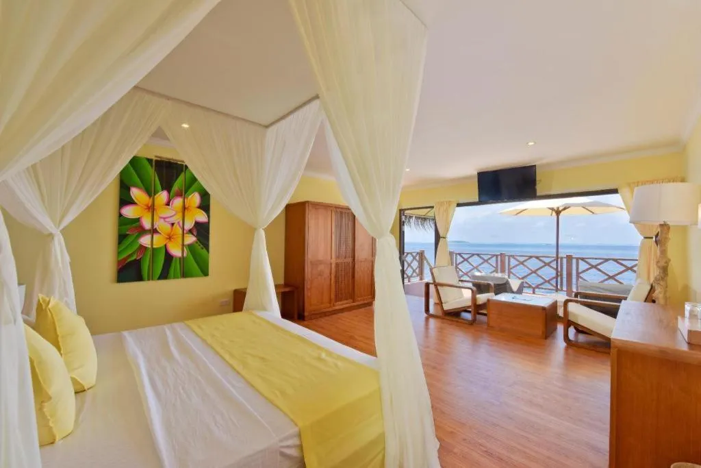 Bed in Angaga Island Resort and Spa