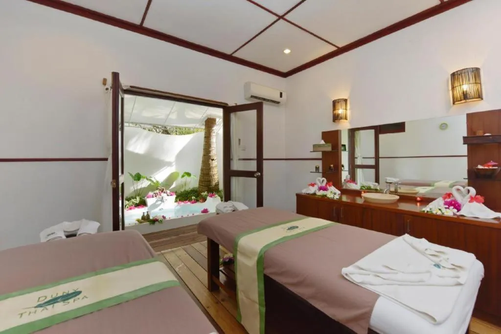 Bed in Angaga Island Resort and Spa