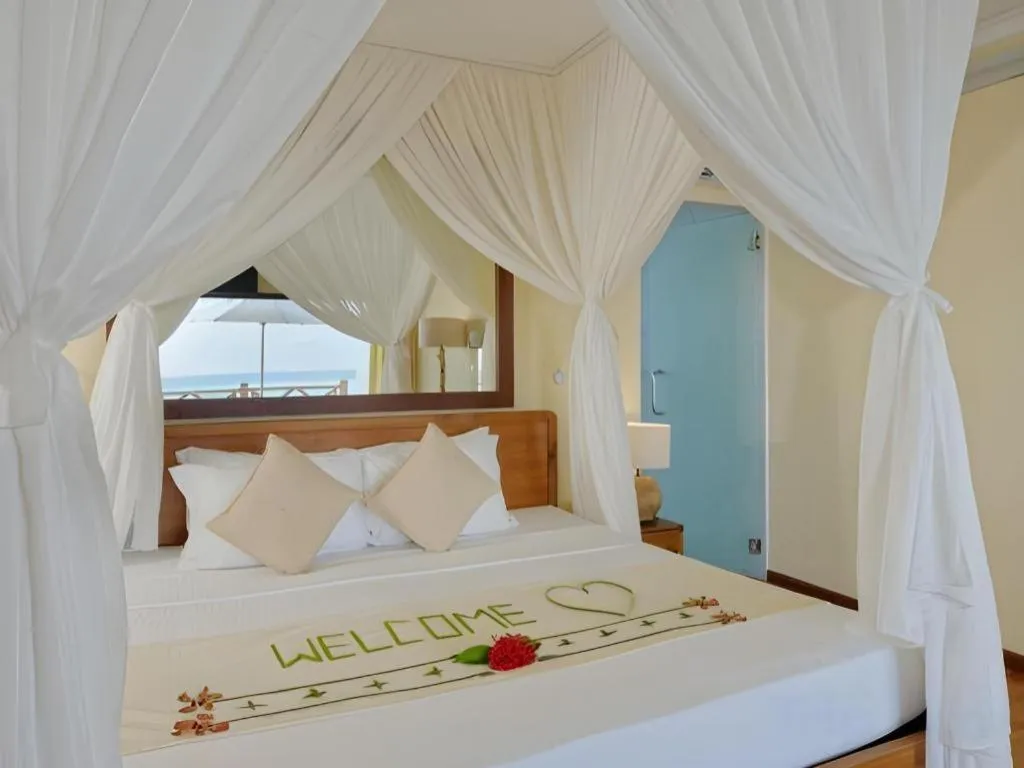 Bed in Angaga Island Resort and Spa