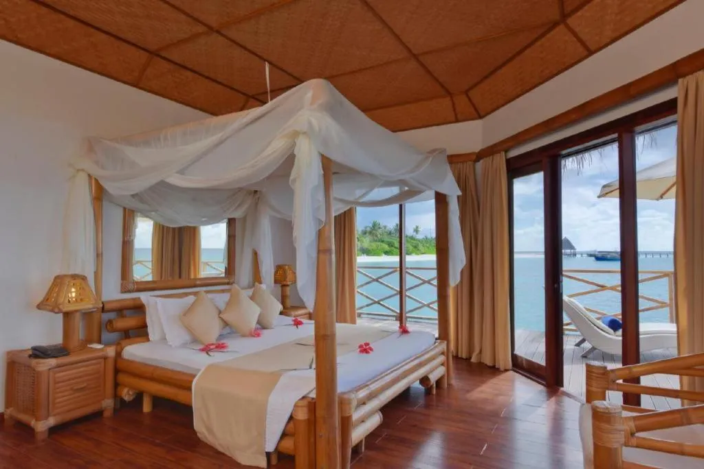 Bed in Angaga Island Resort and Spa