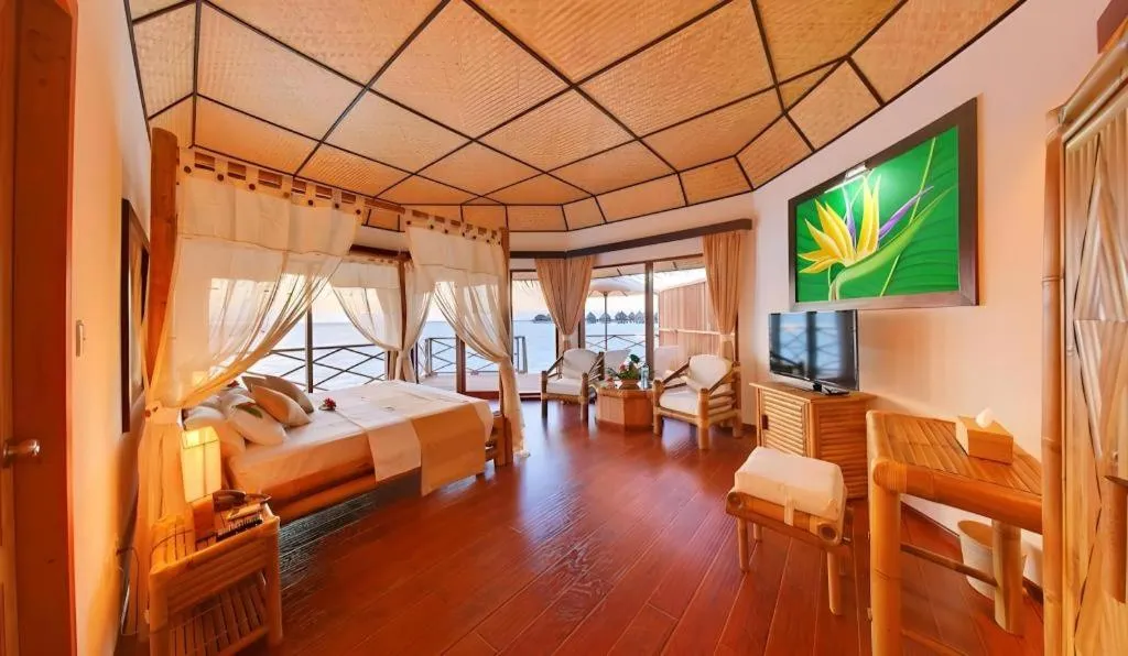 Bed in Angaga Island Resort and Spa