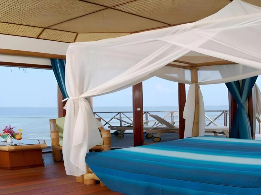 Bed in Angaga Island Resort and Spa