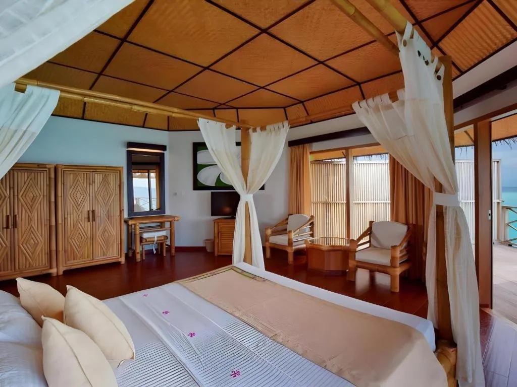 Bed in Angaga Island Resort and Spa
