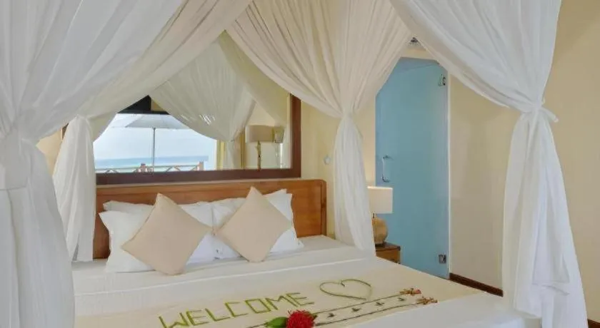 Bed in Angaga Island Resort and Spa