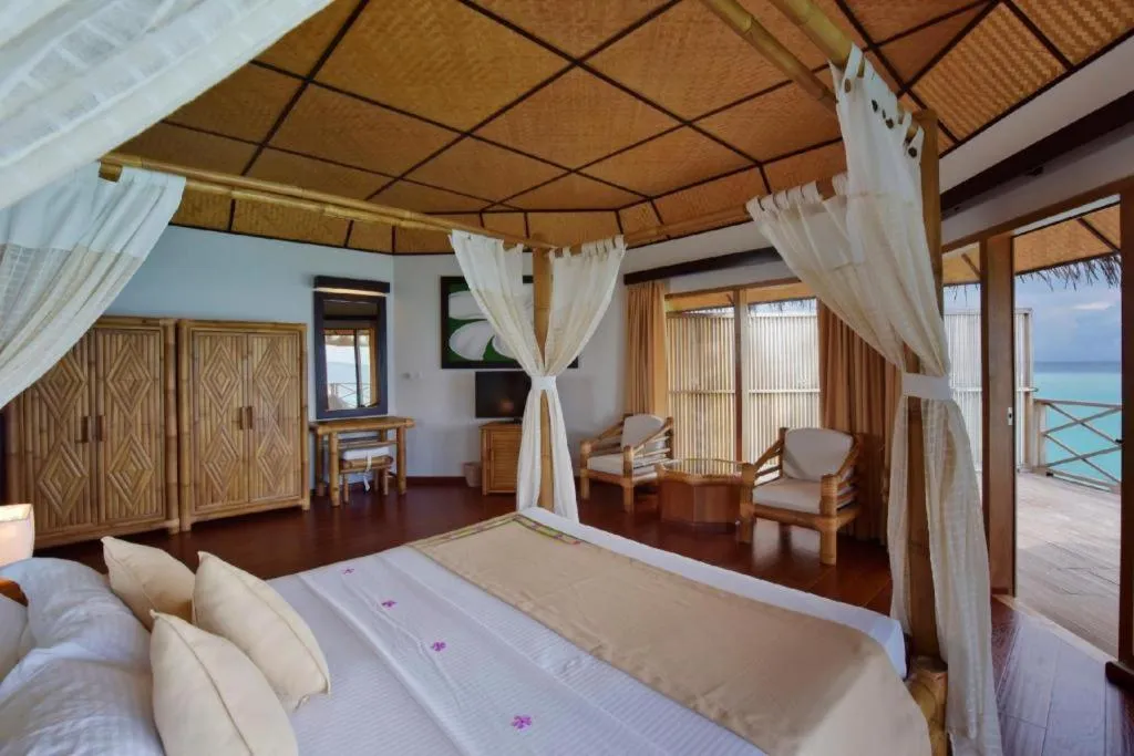 Bed in Angaga Island Resort and Spa