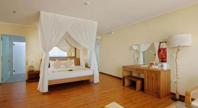 Bed in Angaga Island Resort and Spa