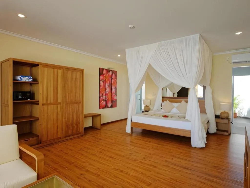 Bed in Angaga Island Resort and Spa