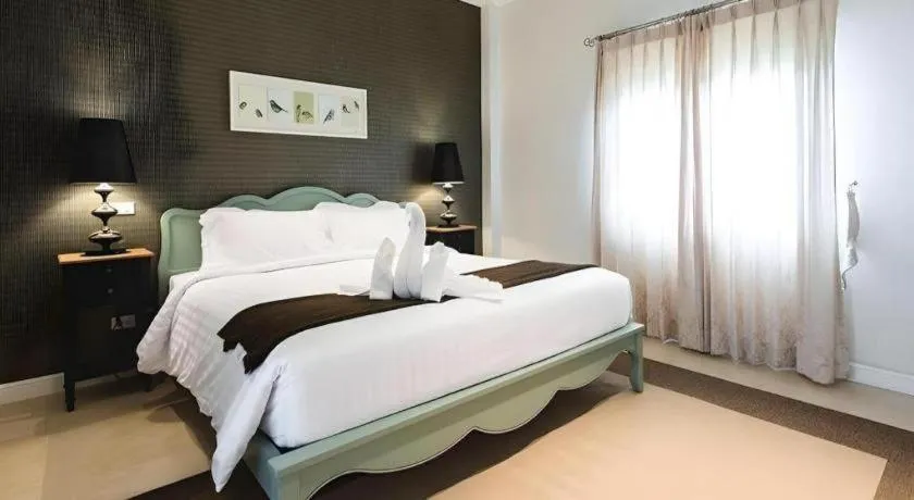 Bed in Verona Boutique Hotel - The Verona Co., Ltd