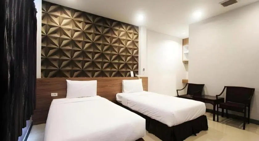 Bed in Seree Grand Resort