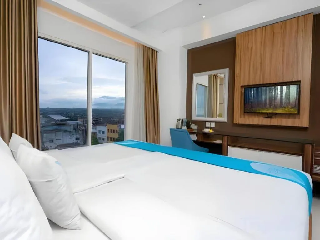 Bed in Java Lotus Hotel Jember