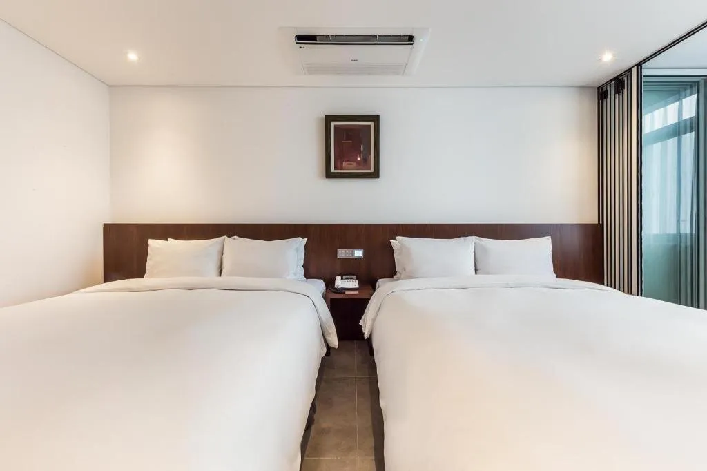 Bed in CS Premier Hotel