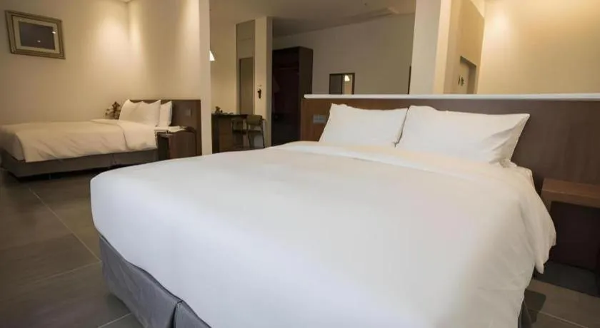 Bed in CS Premier Hotel