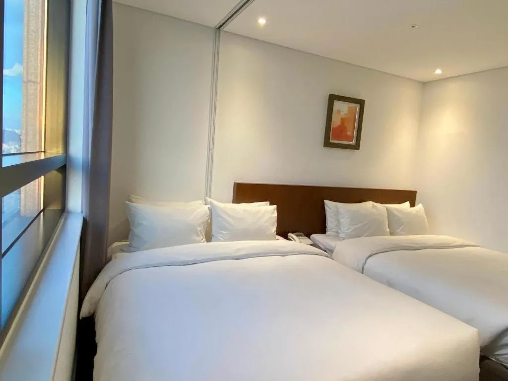 Bed in CS Premier Hotel