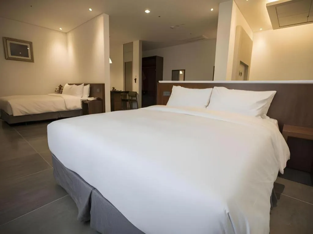 Bed in CS Premier Hotel