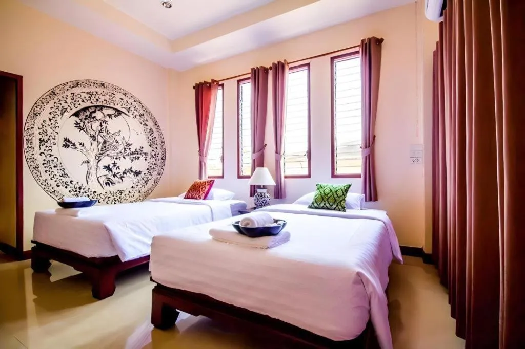 Bed in Wake Up at Muang Kao Boutique Hotel