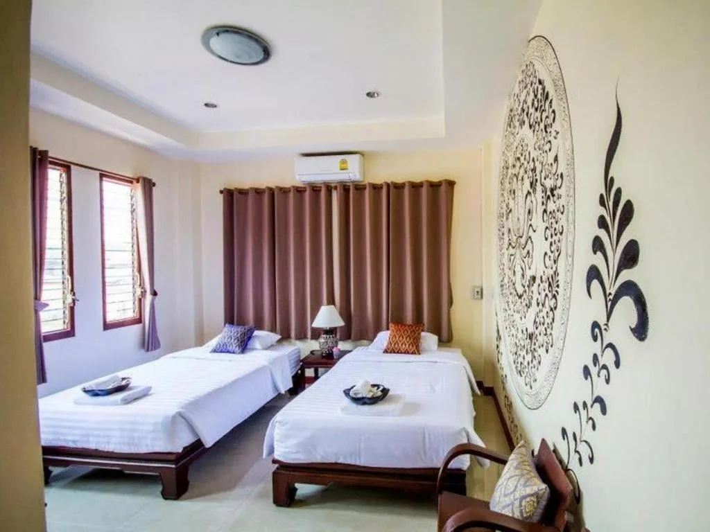 Bed in Wake Up at Muang Kao Boutique Hotel