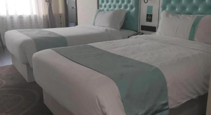 Bed in Xana Hotelle Beijing Qianmen Footbridge Metro Station