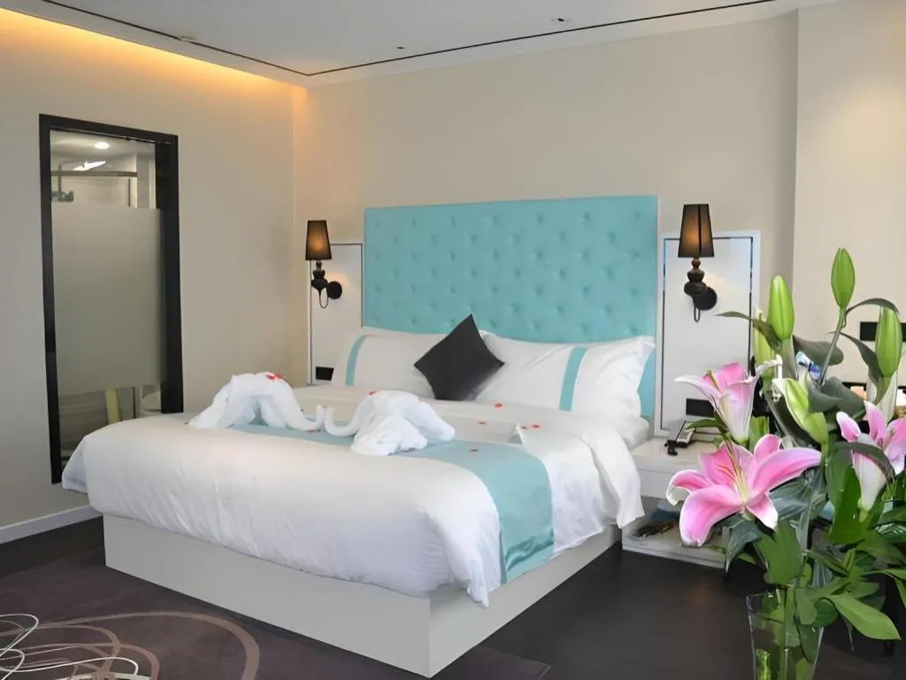 Bed in Xana Hotelle Beijing Qianmen Footbridge Metro Station