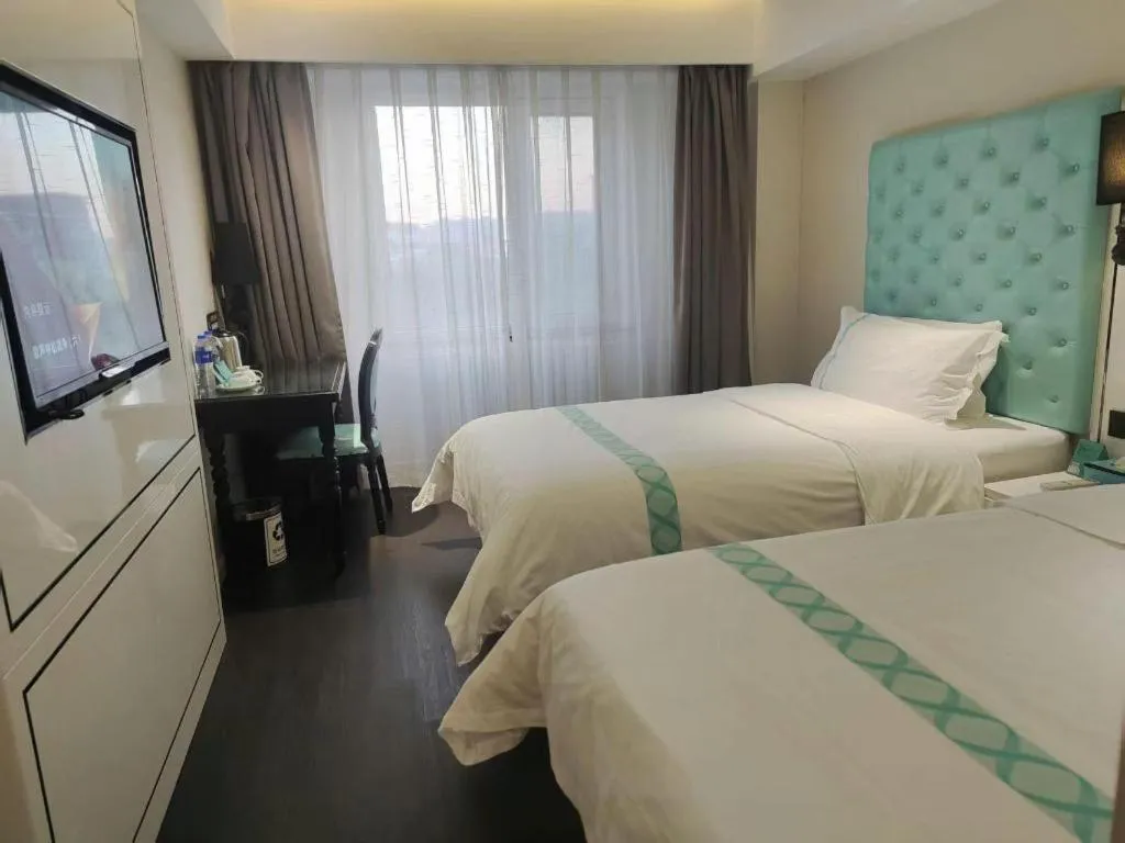 Bed in Xana Hotelle Beijing Qianmen Footbridge Metro Station