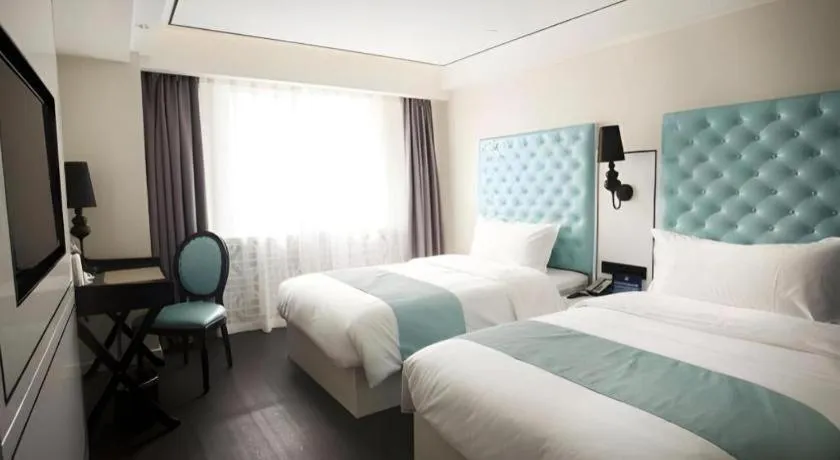 Bed in Xana Hotelle Beijing Qianmen Footbridge Metro Station