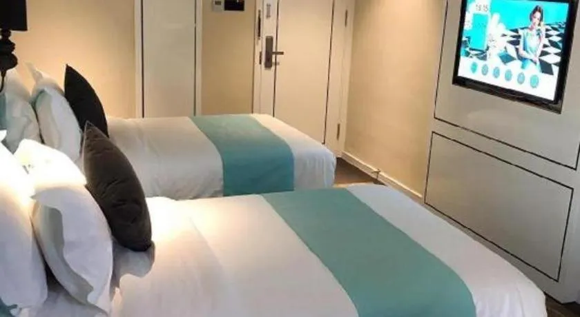 Bed in Xana Hotelle Beijing Qianmen Footbridge Metro Station
