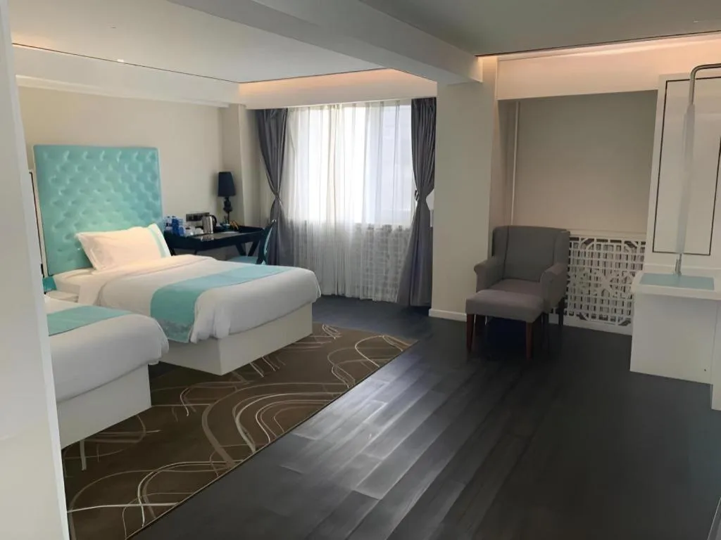 Bed in Xana Hotelle Beijing Qianmen Footbridge Metro Station