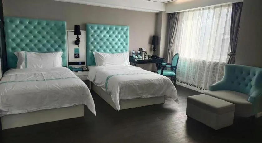 Bed in Xana Hotelle Beijing Qianmen Footbridge Metro Station