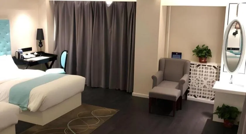 Bed in Xana Hotelle Beijing Qianmen Footbridge Metro Station