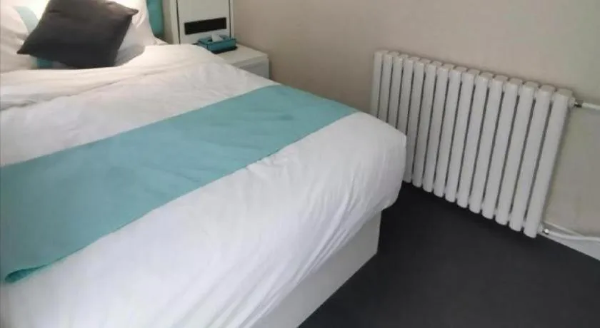 Bed in Xana Hotelle Beijing Qianmen Footbridge Metro Station