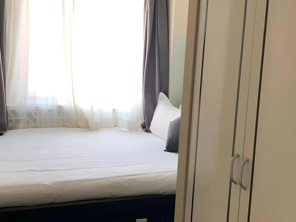 Bed in Xana Hotelle Beijing Qianmen Footbridge Metro Station