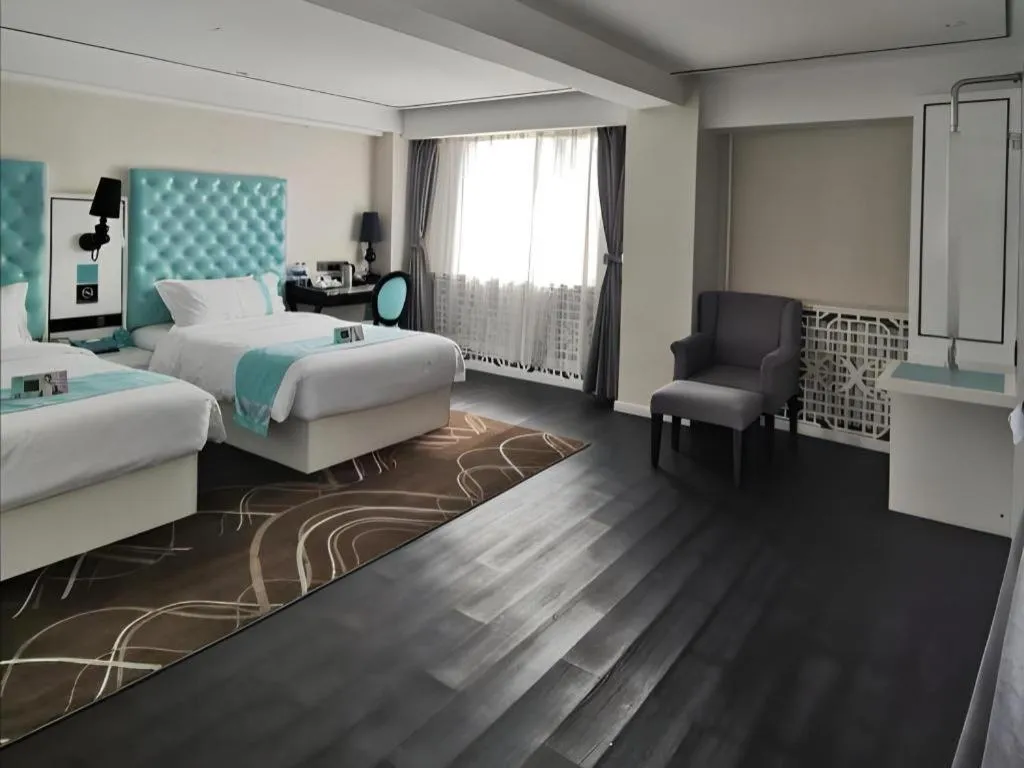 Bed in Xana Hotelle Beijing Qianmen Footbridge Metro Station