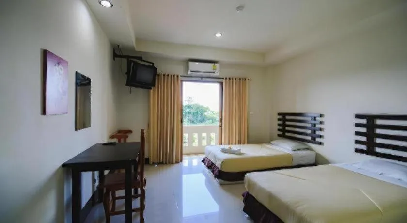 Bed in AmornSukhothai Hotel