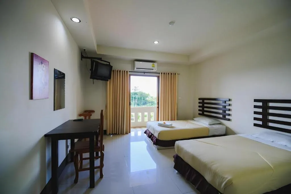 Bed in AmornSukhothai Hotel